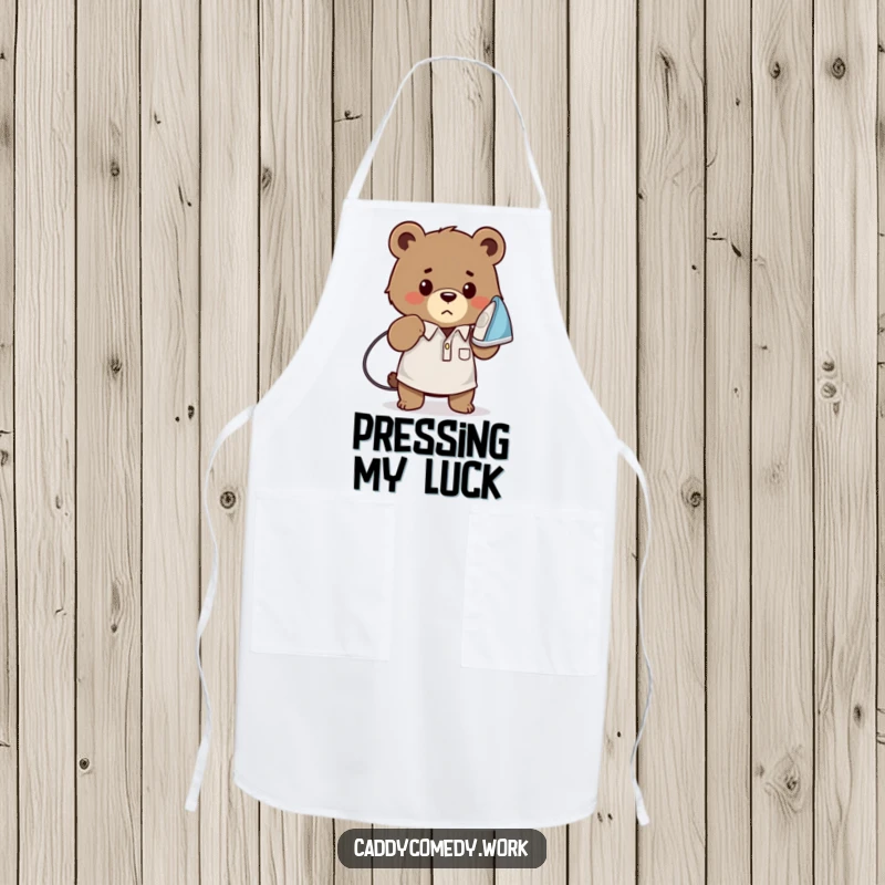 Funny bear golfer apron with a determined bear ironing a golf shirt, practical and humorous kitchen wear, a funny gift.