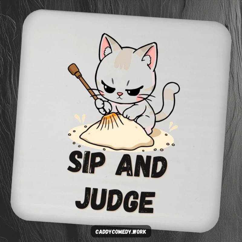 Funny cat raking a sand trap on a drink coaster, a focused way to protect surfaces.