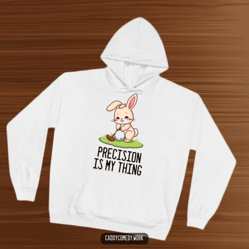 Funny hoodie of a playful rabbit golfer intensely focused on making a putt on a golf course.